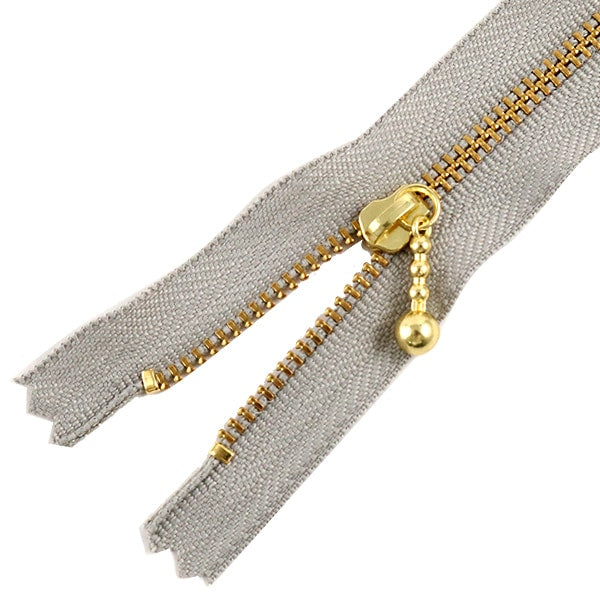 سحاب "سحاب ذهبي مع خرز 18سم اللون 576" YKK