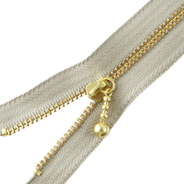 Fermeture éclair "Or avec des ballesFermeture éclair 50cm 576 Couleur DNDBL MGC33-50576" YKK