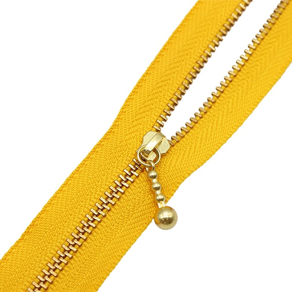 Fermeture éclair "Or avec des ballesFermeture éclair 20 cm 506 Couleur 3MGC-20506" YKK