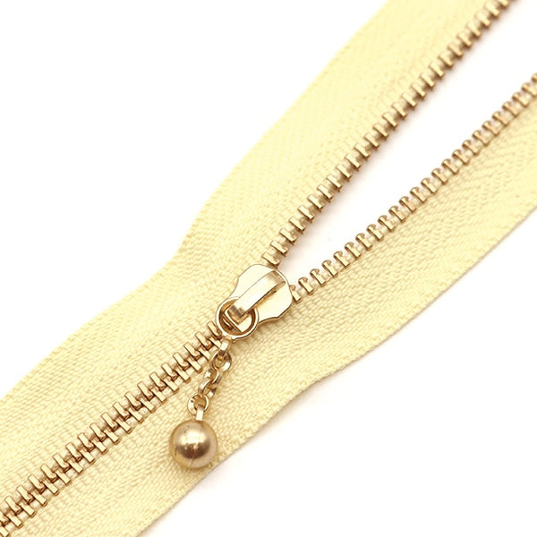 سحاب ``لون ذهبي مع الخرزسحاب 30 سم اللون 345 3MGC-30BLYZ” YKK