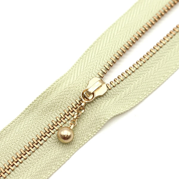 سحاب ``لون ذهبي مع الخرزسحاب 30 سم رقم 881 لون 3MGC-30BLYZ” YKK