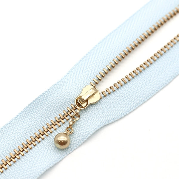 سحاب ``لون ذهبي مع الخرزسحاب 30 سم 542 لون 3MGC-30BLYZ” YKK