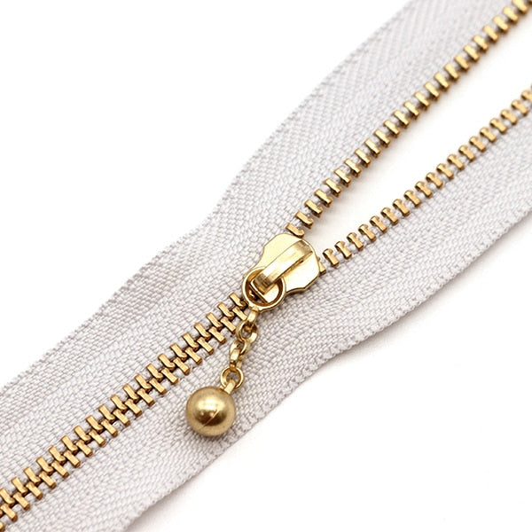 سحاب ``لون ذهبي مع الخرزسحاب 30 سم اللون 337 3MGC-30BLYZ” YKK