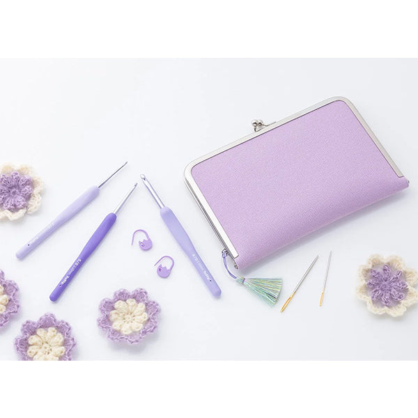 ETIMO Murasaki lifestyle shot, purple hooks and clasp pouch with tassel and notions