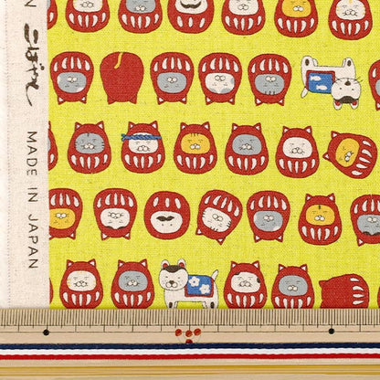 [Quantity from 5] Fabric "Cotton Linen Canvas Cat Daruma Yellow KTS7146-C" COTTON KOBAYASHI