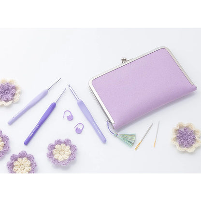 ETIMO Murasaki lifestyle shot, purple hooks and clasp pouch with tassel and notions