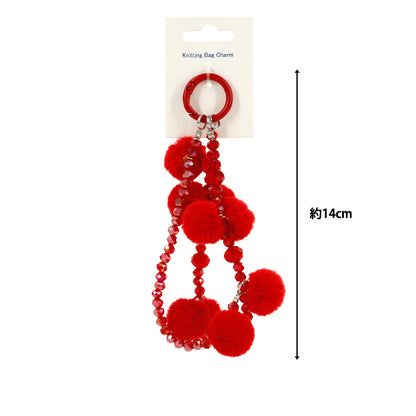Articles ménagers ``Bijou de sac tricot type pompon rouge"
