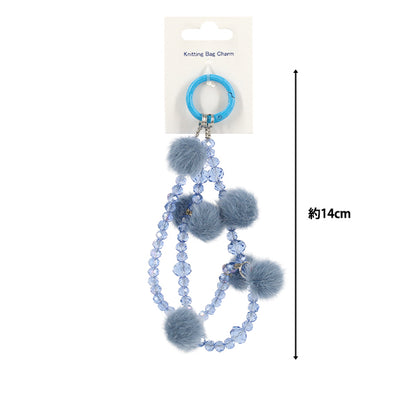 Articles ménagers "Bijou de sac tricot pompon type saxophone""
