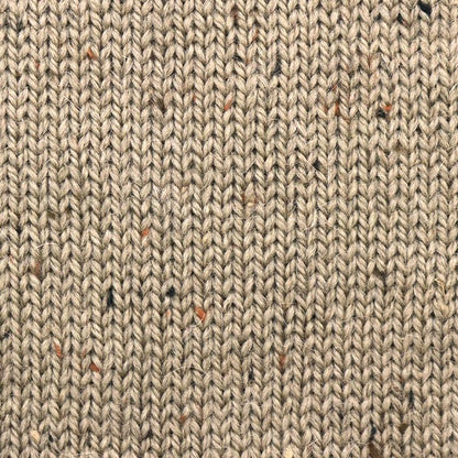 Close-up of Alpaca Tweed Color 12 showing blended tweed fibers